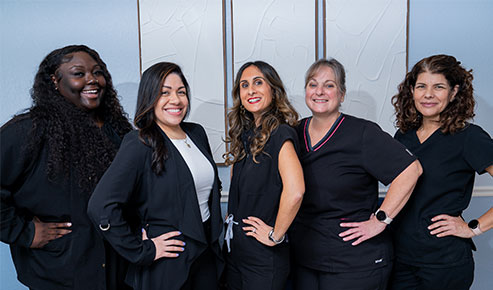 cape coral team in front of the office building